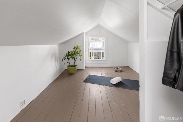 bonus room with lofted ceiling and hardwood / wood-style floors