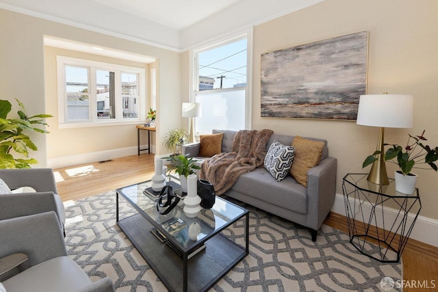 living room featuring a wealth of natural light and light wood-type flooring