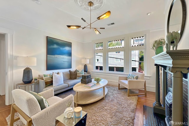 living room featuring hardwood / wood-style flooring and a chandelier