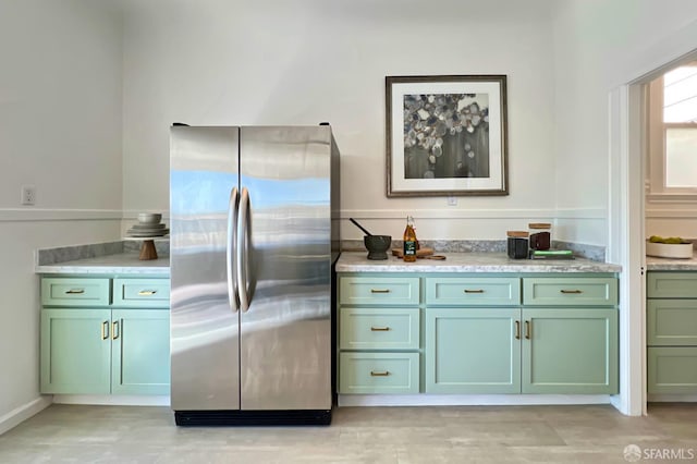 kitchen featuring stainless steel fridge