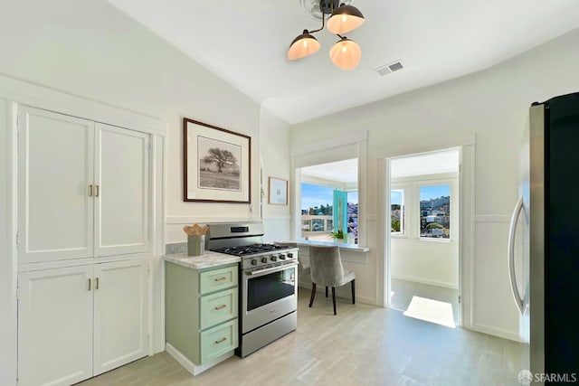 kitchen with white cabinetry and appliances with stainless steel finishes