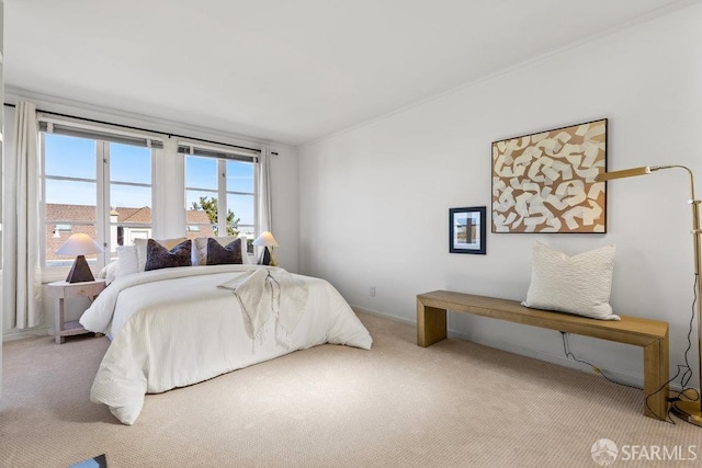 carpeted bedroom with crown molding