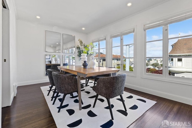 dining room featuring recessed lighting, wood finished floors, baseboards, and ornamental molding