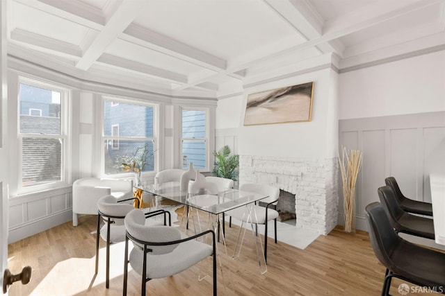 sunroom / solarium with a fireplace, coffered ceiling, and beamed ceiling