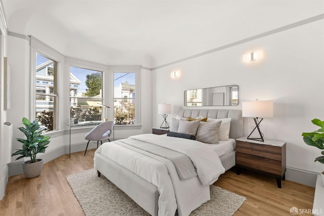 bedroom with light wood-type flooring