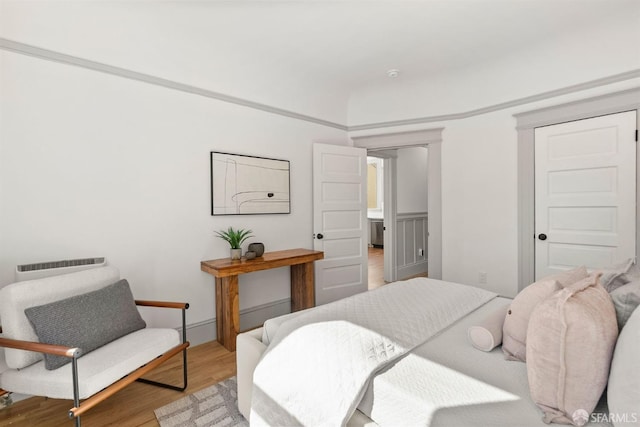 bedroom featuring wood finished floors