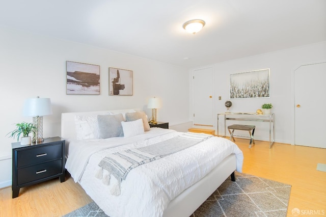 bedroom with hardwood / wood-style floors