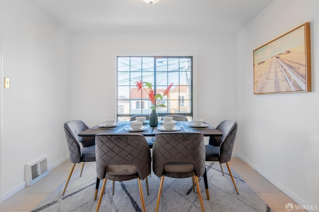 dining space with light tile patterned flooring