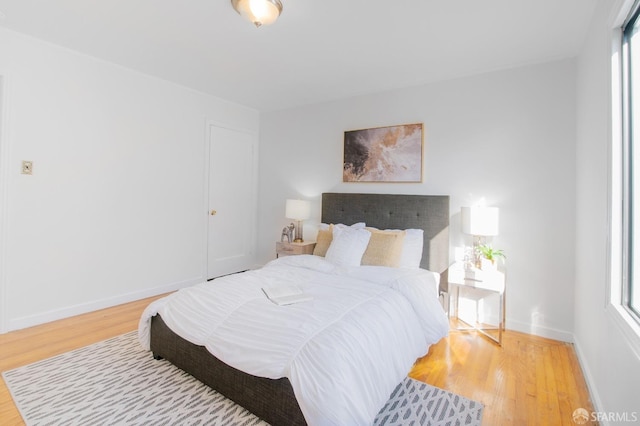 bedroom with hardwood / wood-style floors