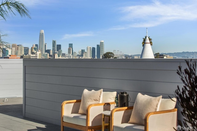 view of patio / terrace featuring a city view