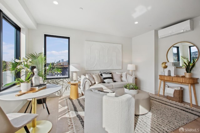 living area featuring baseboards, a wall mounted air conditioner, wood finished floors, and recessed lighting