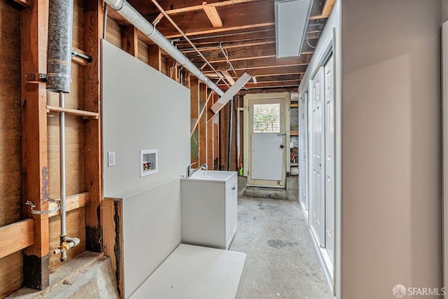 interior space with washer hookup and a sink