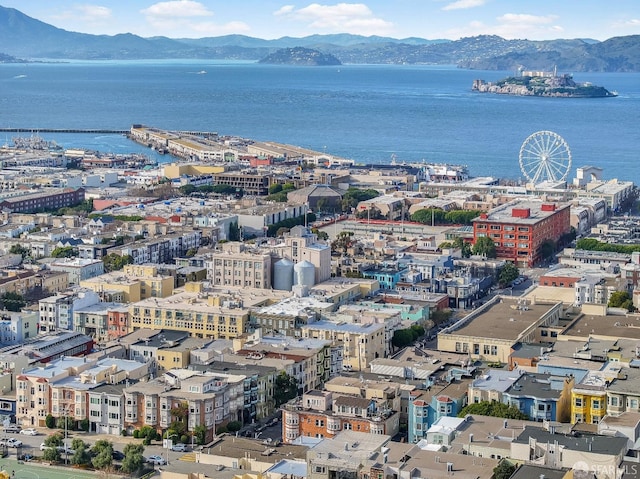 bird's eye view featuring a view of city and a water and mountain view