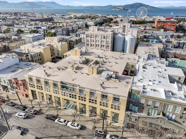 drone / aerial view with a mountain view and a city view