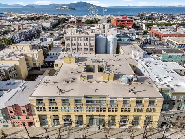 drone / aerial view with a view of city and a mountain view