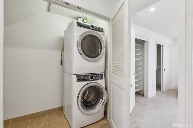 239 8th St Unit 14, San Francisco, CA 94103 - washroom featuring stacked washer / drying machine and baseboards