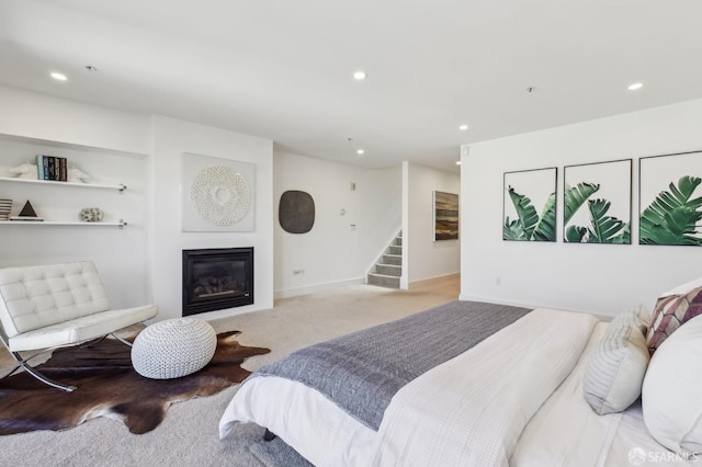 239 8th St Unit 14, San Francisco, CA 94103 - bedroom featuring a glass covered fireplace, carpet flooring, recessed lighting, and baseboards