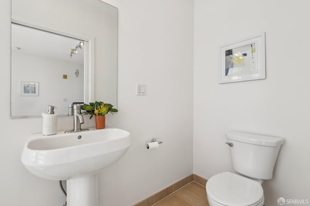 239 8th St Unit 14, San Francisco, CA 94103 - half bath with toilet, baseboards, and a sink