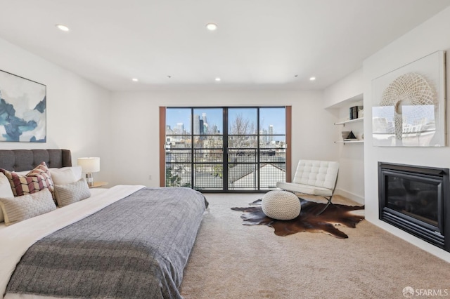 239 8th St Unit 14, San Francisco, CA 94103 - bedroom with carpet, recessed lighting, and a glass covered fireplace