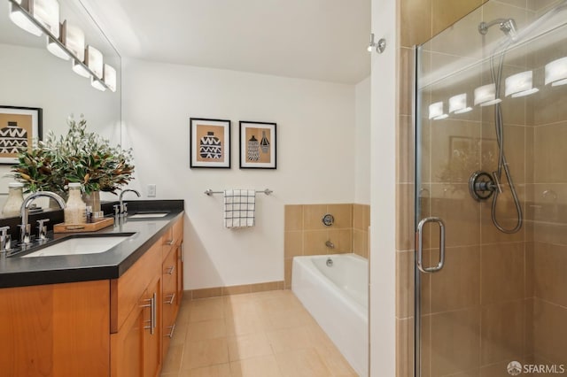 239 8th St Unit 14, San Francisco, CA 94103 - full bathroom featuring double vanity, a garden tub, a shower stall, baseboards, and tile patterned flooring