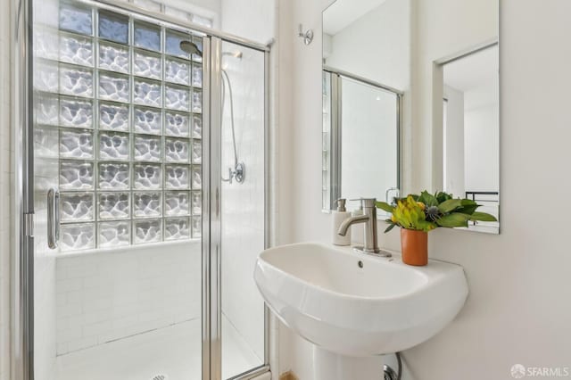 239 8th St Unit 14, San Francisco, CA 94103 - full bath featuring a stall shower, a sink, and healthy amount of natural light