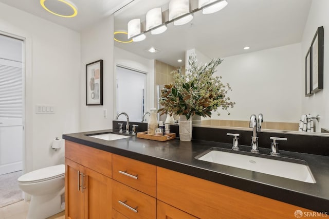 239 8th St Unit 14, San Francisco, CA 94103 - bathroom with double vanity, toilet, and recessed lighting