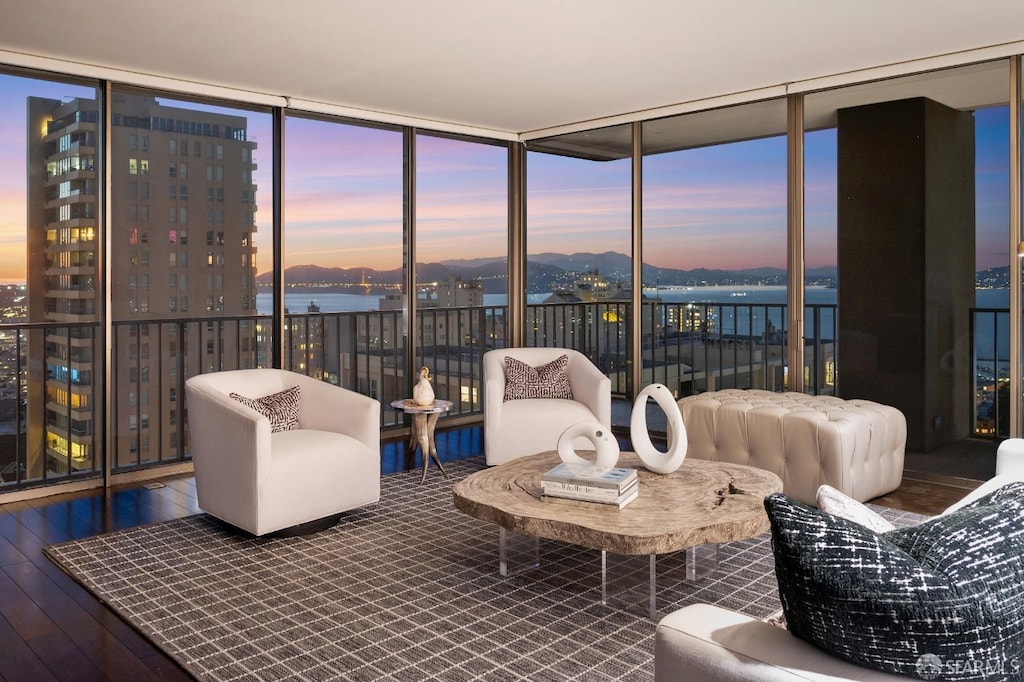 sunroom / solarium with a water view