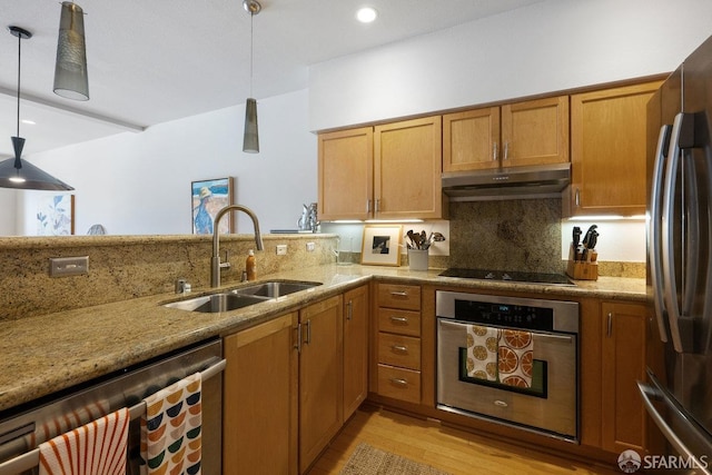 364 Arkansas St, San Francisco, CA 94107 - kitchen featuring under cabinet range hood, appliances with stainless steel finishes, light stone countertops, and a sink