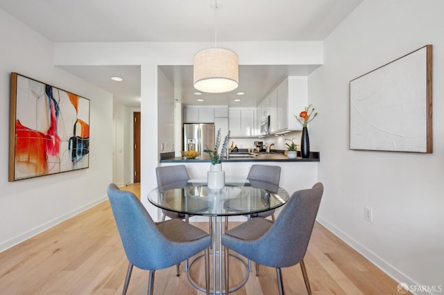 dining room with light hardwood / wood-style floors