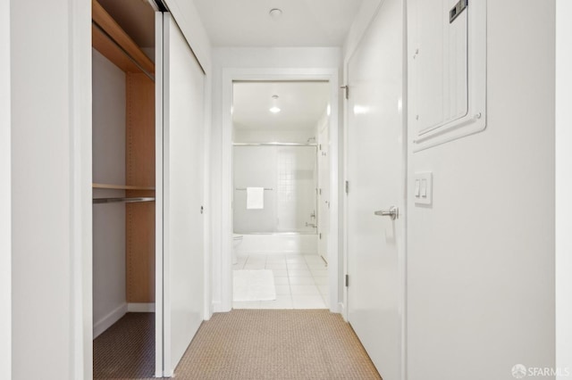 corridor with light tile patterned floors