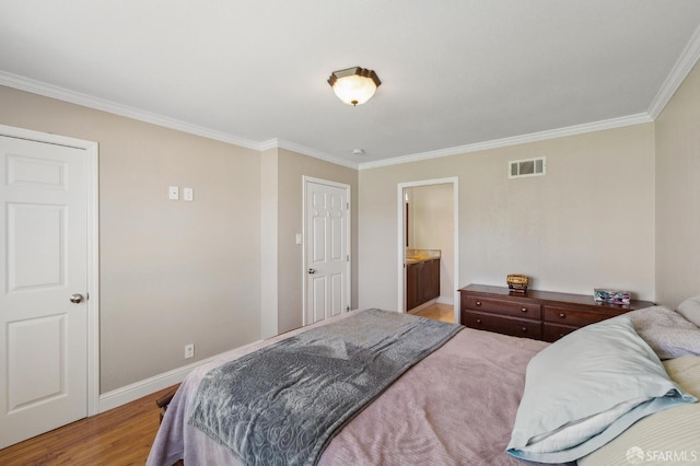 67 Castillejo Dr, Daly City, CA 94015 - bedroom featuring crown molding, baseboards, light wood finished floors, and ensuite bath