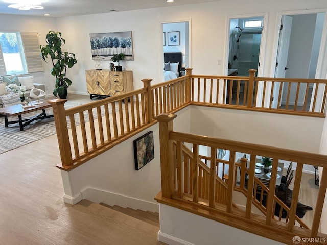 stairway featuring hardwood / wood-style floors