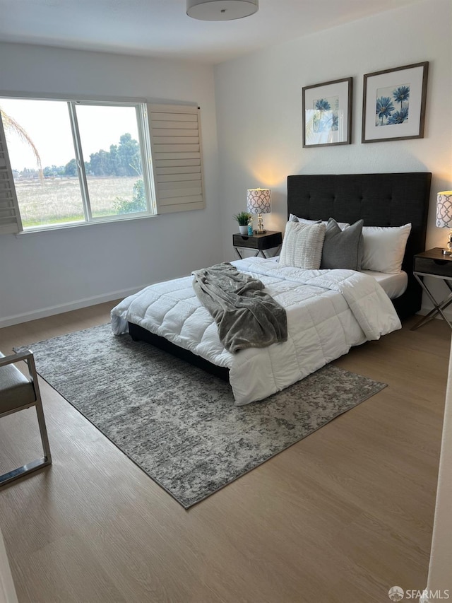 bedroom featuring hardwood / wood-style flooring