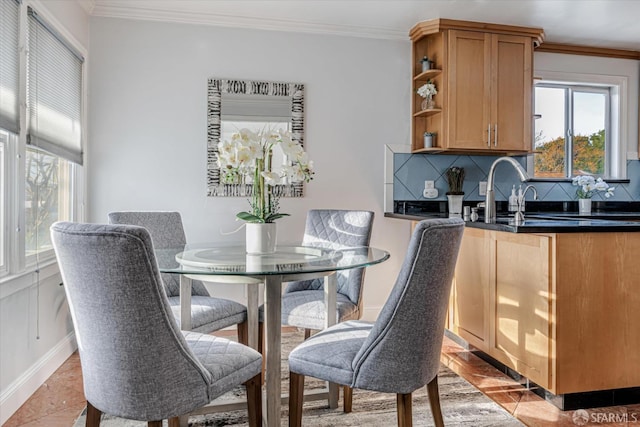interior space featuring a wealth of natural light, open shelves, and crown molding
