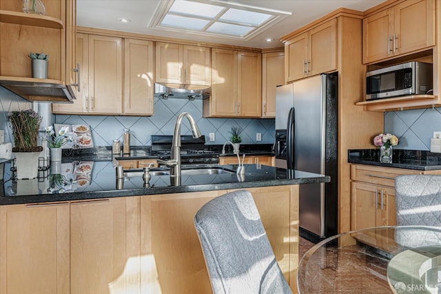 kitchen featuring open shelves, recessed lighting, backsplash, appliances with stainless steel finishes, and dark stone countertops