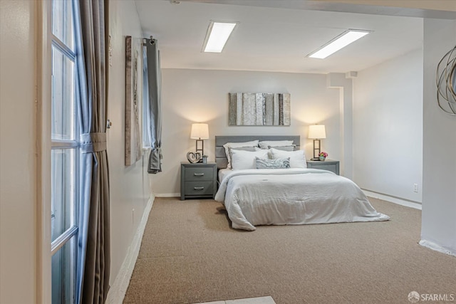 carpeted bedroom with baseboards