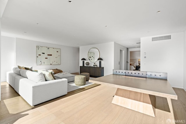 living room with light hardwood / wood-style flooring