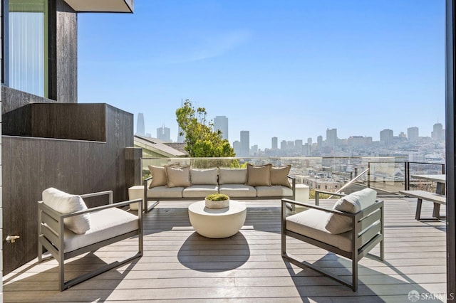 wooden terrace featuring an outdoor living space