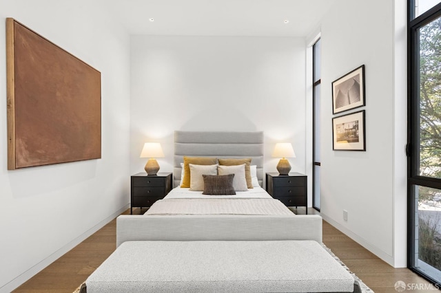 bedroom with light hardwood / wood-style flooring