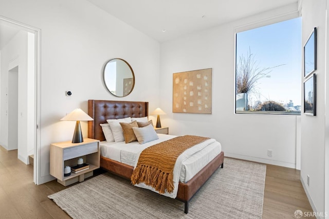 bedroom with light hardwood / wood-style flooring