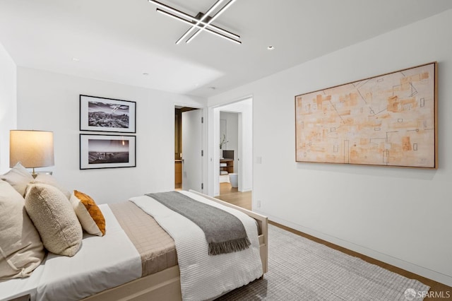 bedroom featuring wood-type flooring