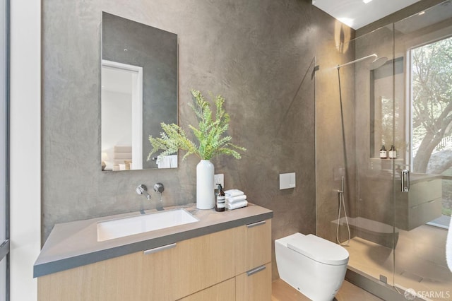 bathroom featuring toilet, an enclosed shower, and vanity