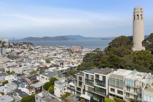 birds eye view of property featuring a water and mountain view