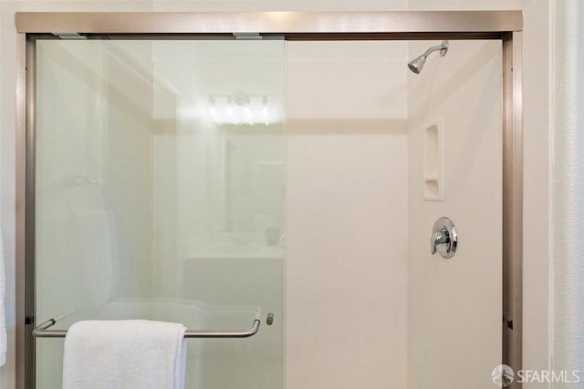 bathroom featuring a shower stall