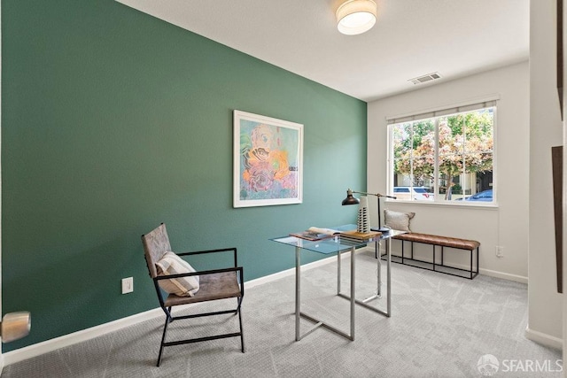 office area featuring baseboards, carpet flooring, and visible vents