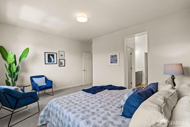 carpeted bedroom featuring baseboards
