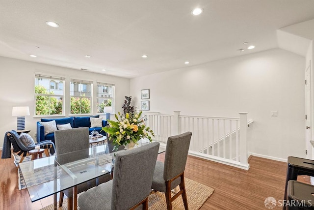 dining area with recessed lighting, baseboards, and wood finished floors