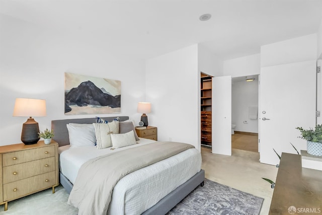 425 1st St Unit 1902, San Francisco, CA 94105 - bedroom featuring light carpet, a walk in closet, and a closet