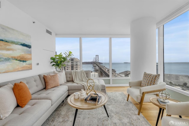 425 1st St Unit 1902, San Francisco, CA 94105 - living area with wood finished floors, plenty of natural light, and a water view
