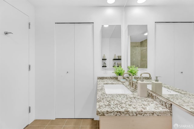 425 1st St Unit 1902, San Francisco, CA 94105 - bathroom featuring vanity, a stall shower, and tile patterned flooring